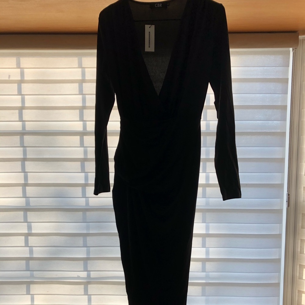Sexy black cocktail dress w/ slit that goes to hip